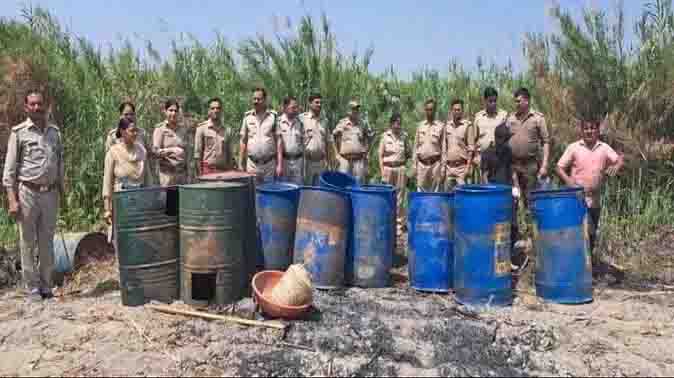 Police raided and seized 180 liters of illegal raw liquor